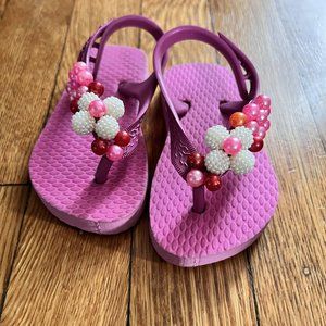 Pink beaded flip-flops